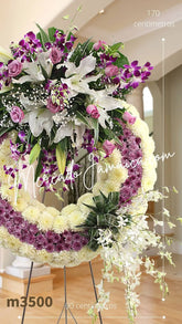 Corona Fúnebre Orquídeas Lila y Blancas un Homenaje Floral Exquisito